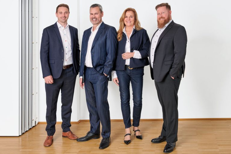 Group photo of management board of OTRS AG (from left to right: Benjamin Müller (CTO), André Mindermann (CEO), Sabine Riedel (CHRO & CMO), Christopher Kuhn (COO)